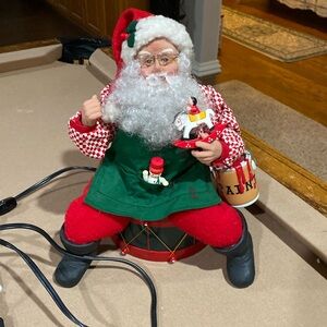 Christmas Santa Sitting on a Drum - electrical.
He moves!!!